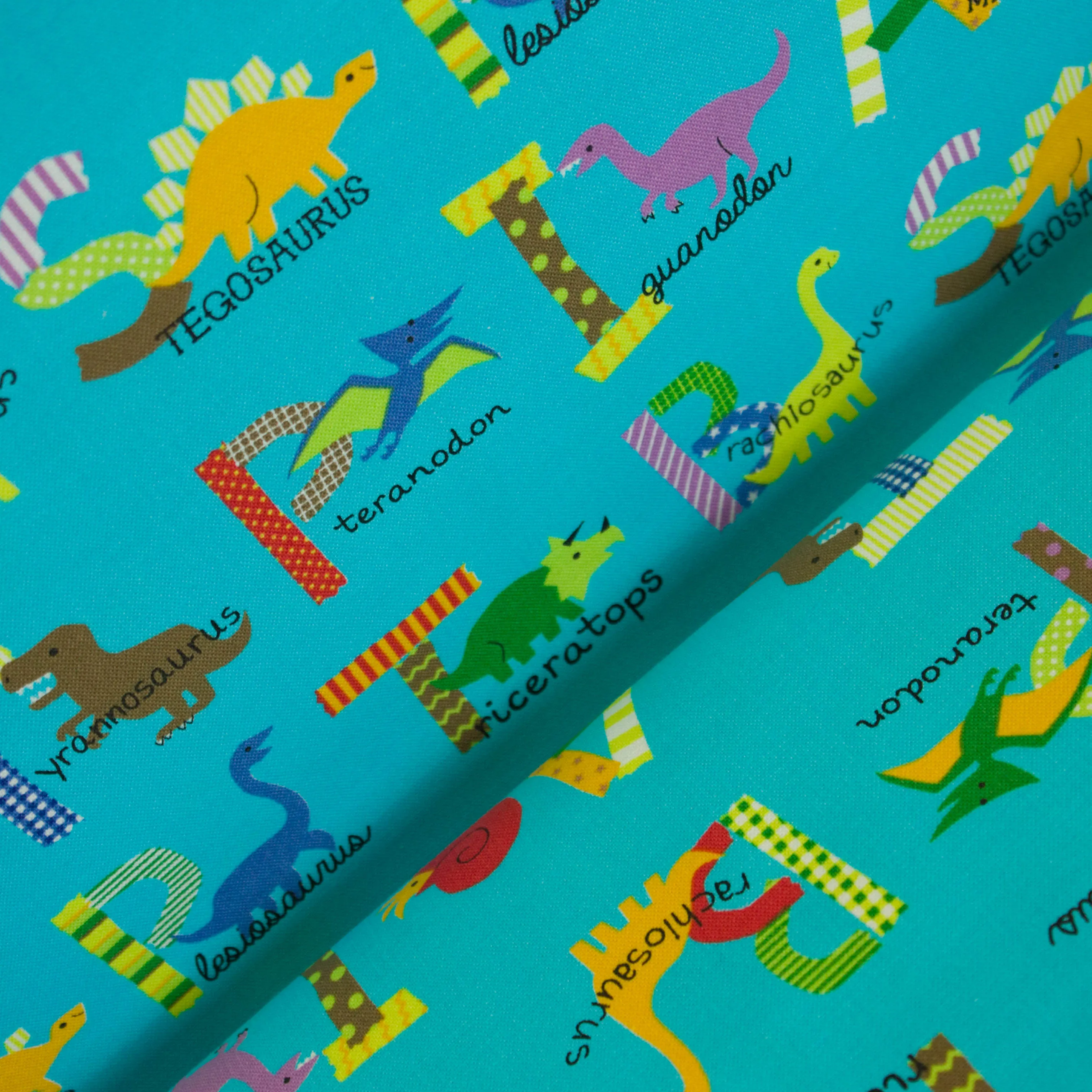 Katoen blauw met dino's en hun benaming